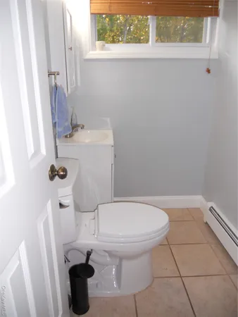 a bathroom with a toilet and a sink