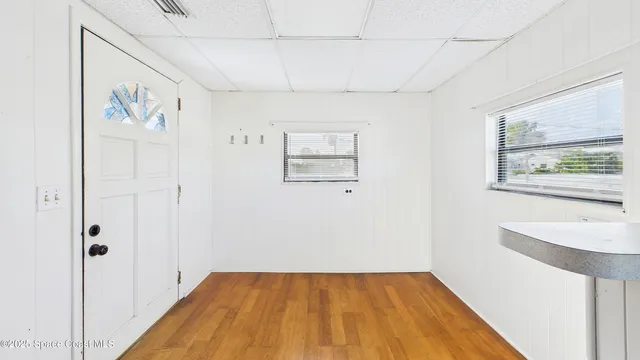 a kitchen with a sink and wooden cabinets
