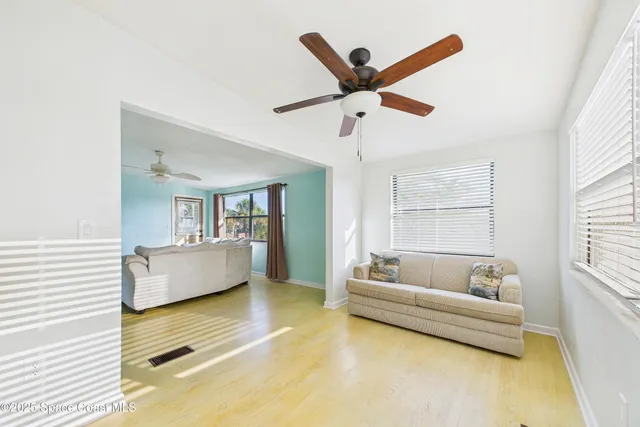a living room with furniture and a window