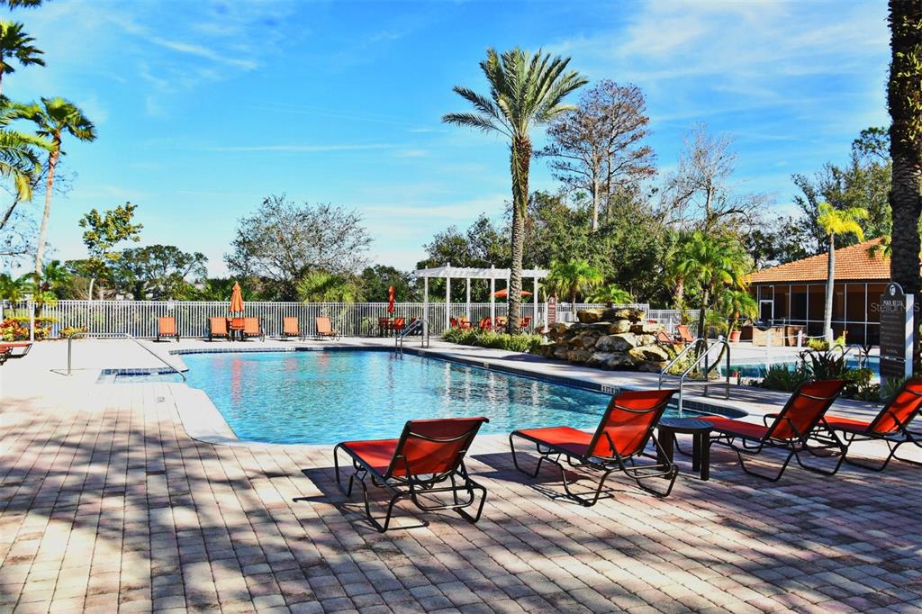5467 Vineland Road, Unit 6308 Orlando, FL 32811 - Photo 2 of 39 a view of a terrace with sitting area