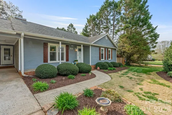 a house view with a garden space