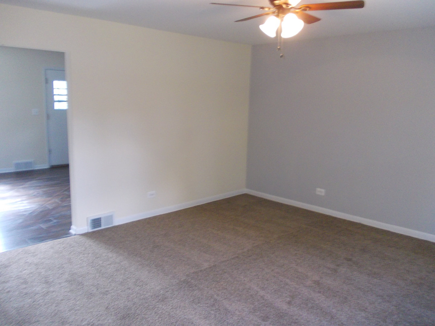 3435 Flossmoor Road Homewood, IL 60430 - Photo 3 of 13 a view of an empty room with a chandelier fan