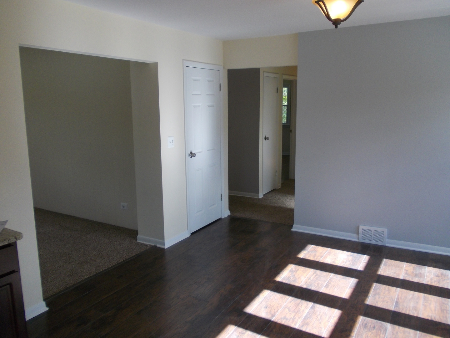 3435 Flossmoor Road Homewood, IL 60430 - Photo 4 of 13 an empty room with wooden floor and windows