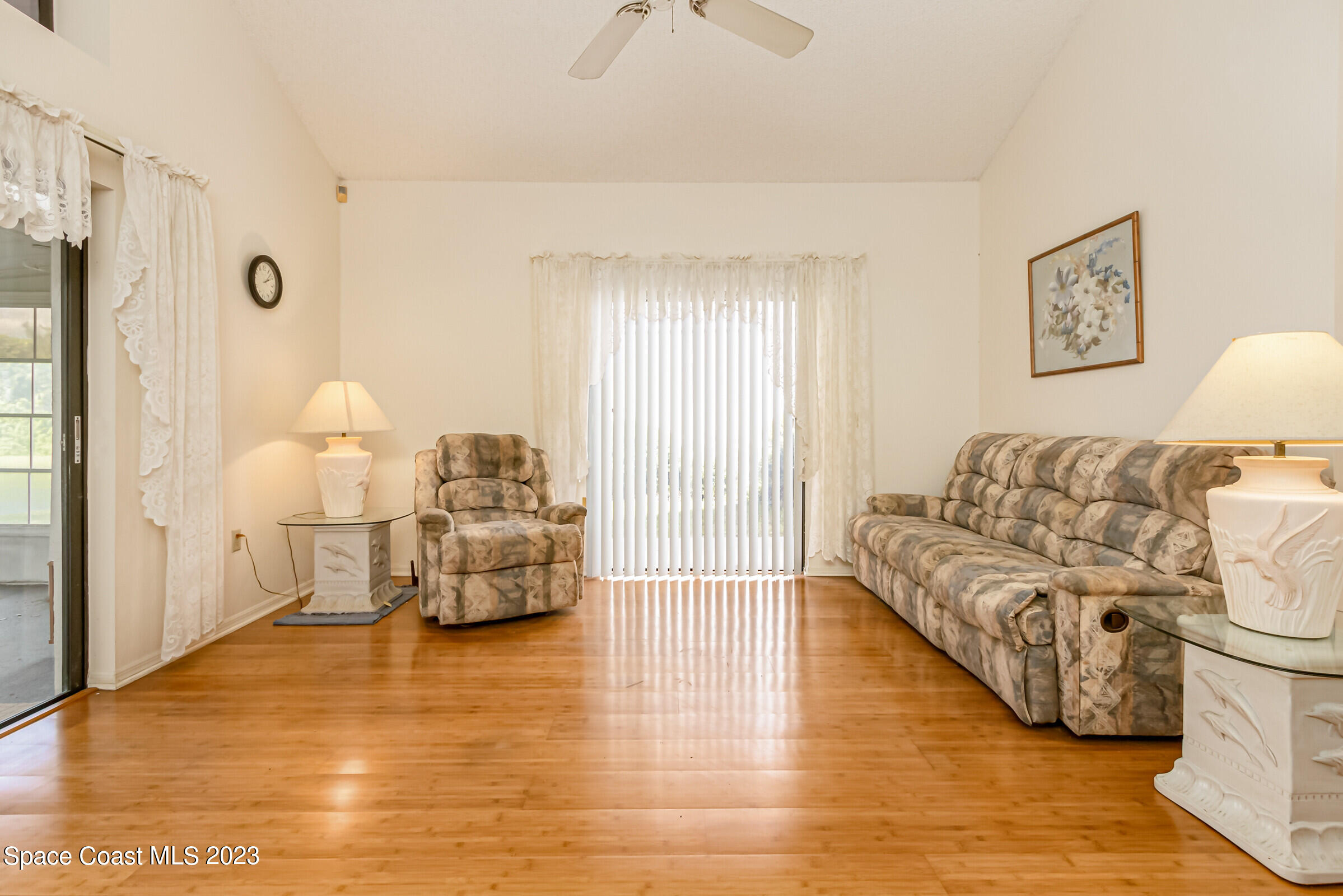 2332 Skywind Circle Melbourne, FL 32935 - Photo 11 of 34 a living room with furniture and a table