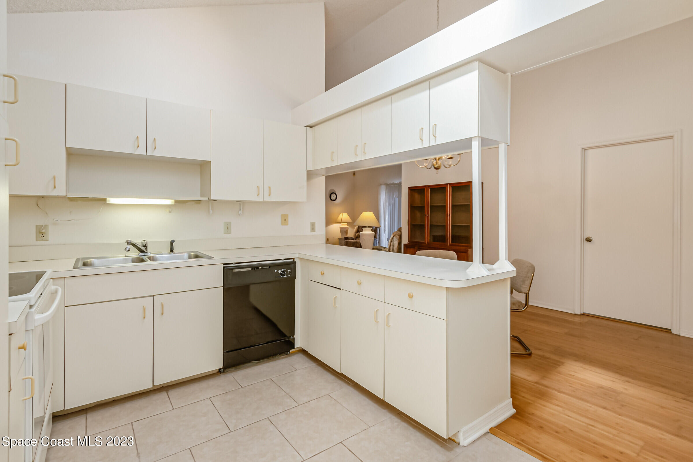 2332 Skywind Circle Melbourne, FL 32935 - Photo 16 of 34 a kitchen with granite countertop cabinets stainless steel appliances and a counter space
