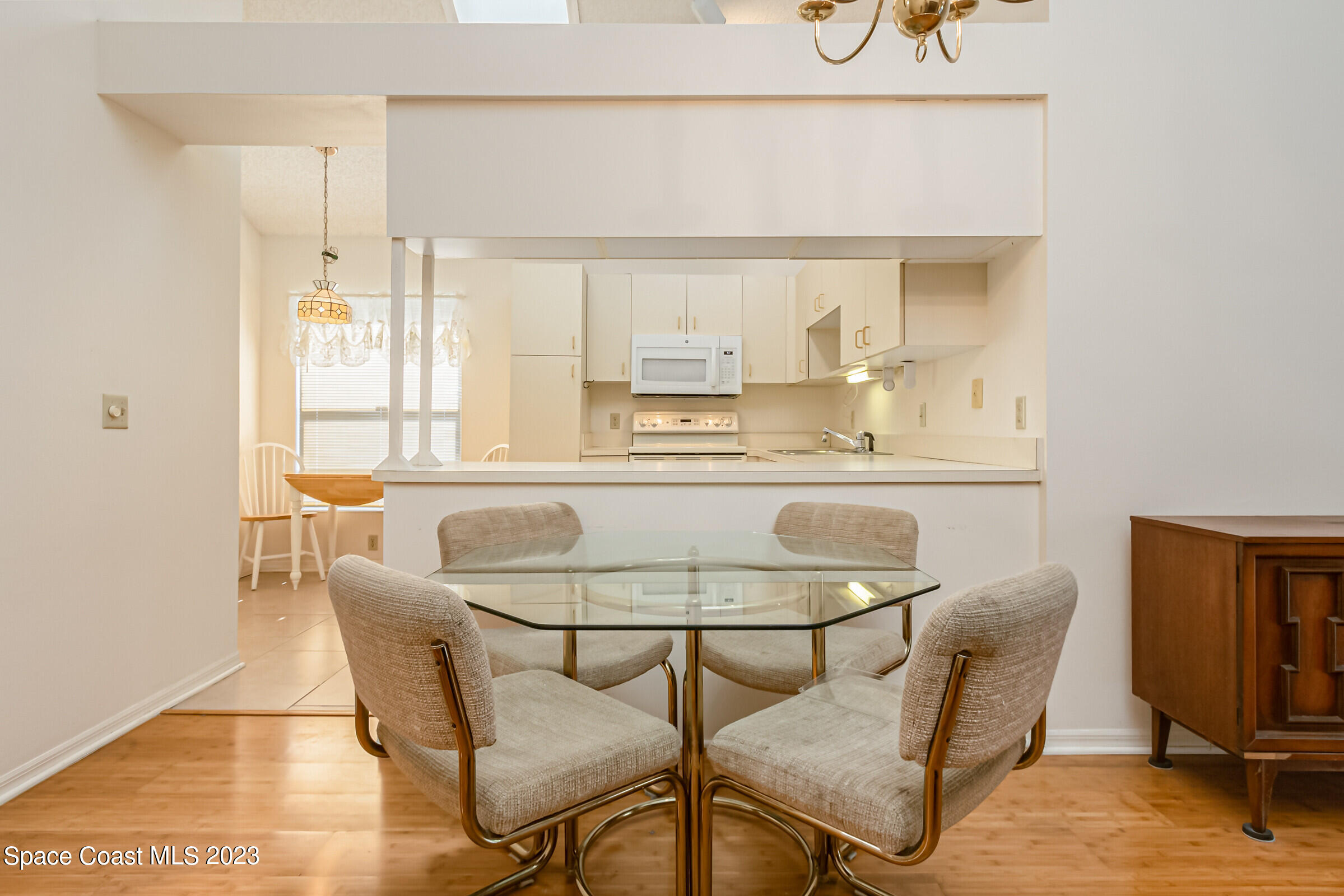 2332 Skywind Circle Melbourne, FL 32935 - Photo 19 of 34 a dining room with furniture and a window