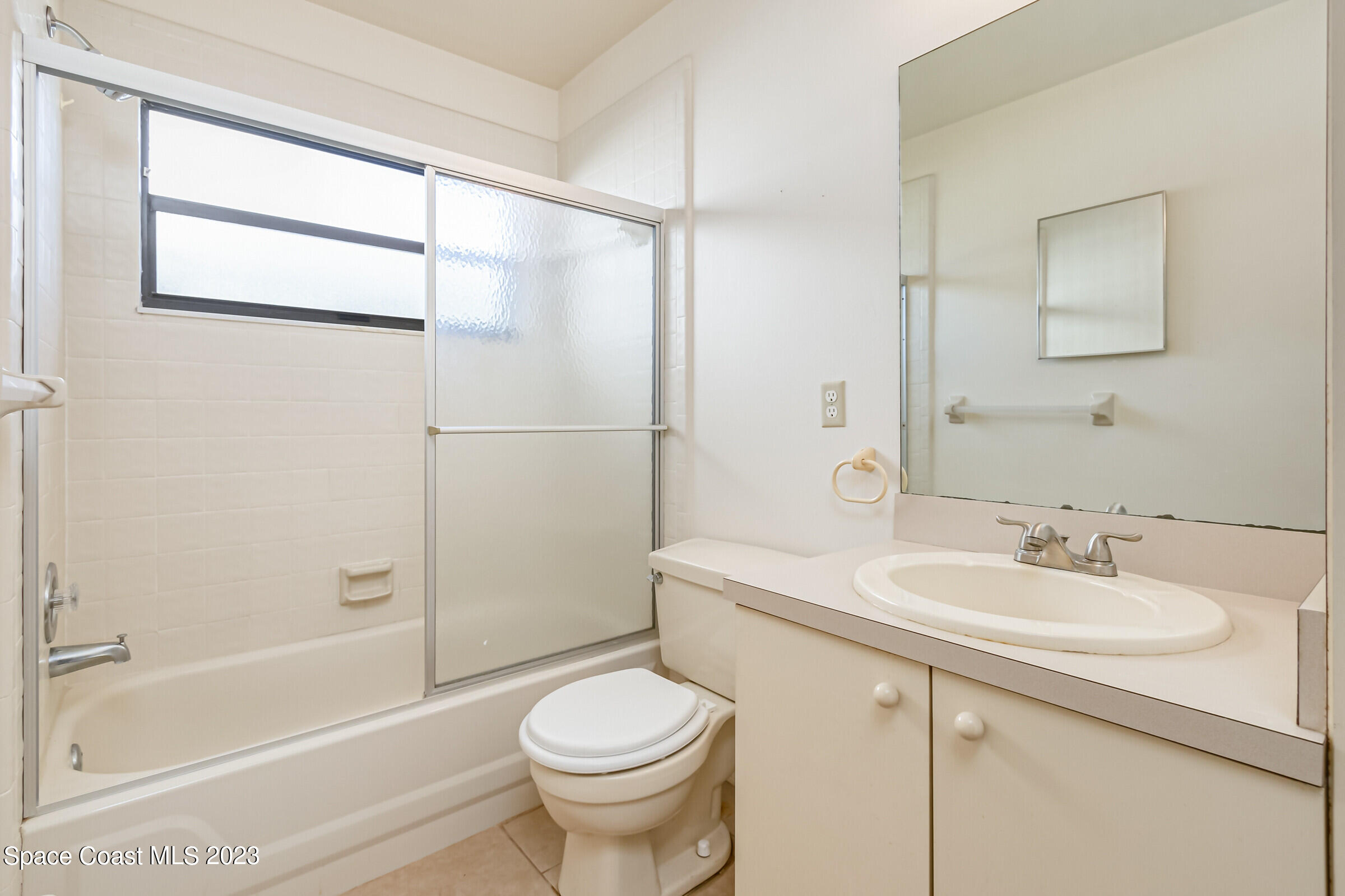 2332 Skywind Circle Melbourne, FL 32935 - Photo 22 of 34 a bathroom with a sink toilet and shower