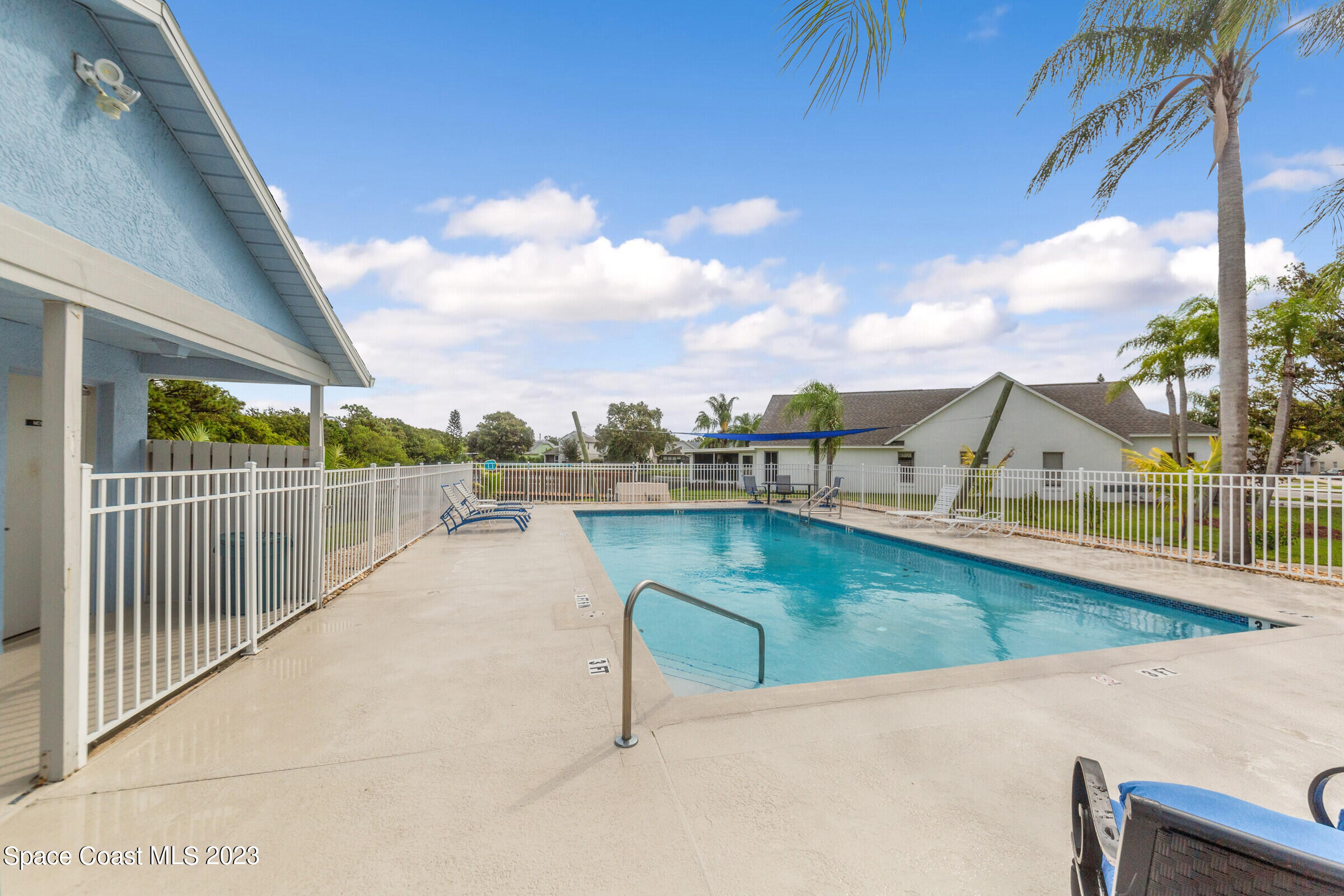 2332 Skywind Circle Melbourne, FL 32935 - Photo 32 of 34 a view of a swimming pool with a lounge chair