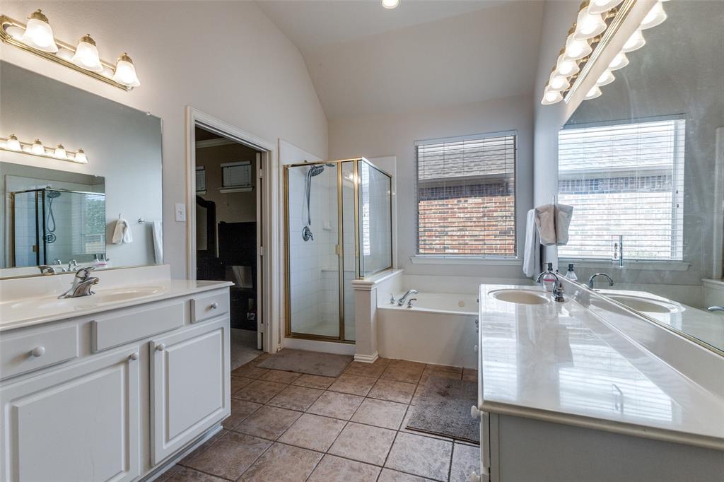 1046 Gold Camp Road Frisco, TX 75033 - Photo 13 of 25 a bathroom with a granite countertop sink mirror bathtub and shower