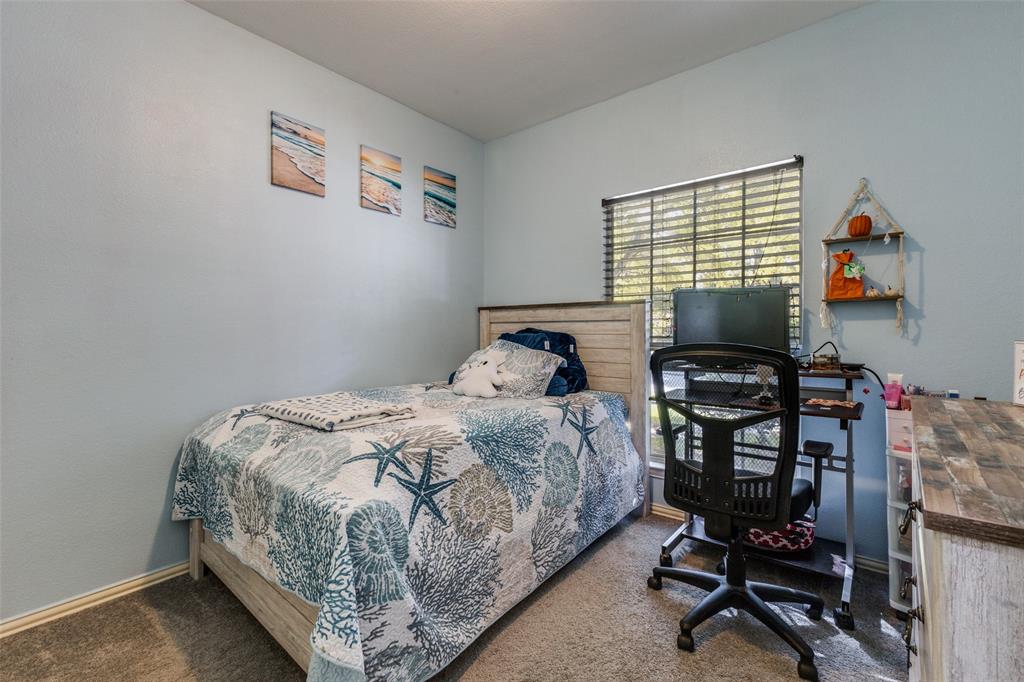 1046 Gold Camp Road Frisco, TX 75033 - Photo 14 of 25 a bedroom with a bed and a desk