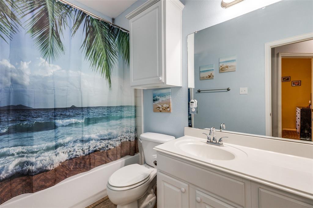 1046 Gold Camp Road Frisco, TX 75033 - Photo 15 of 25 a bathroom with a sink a toilet and a mirror