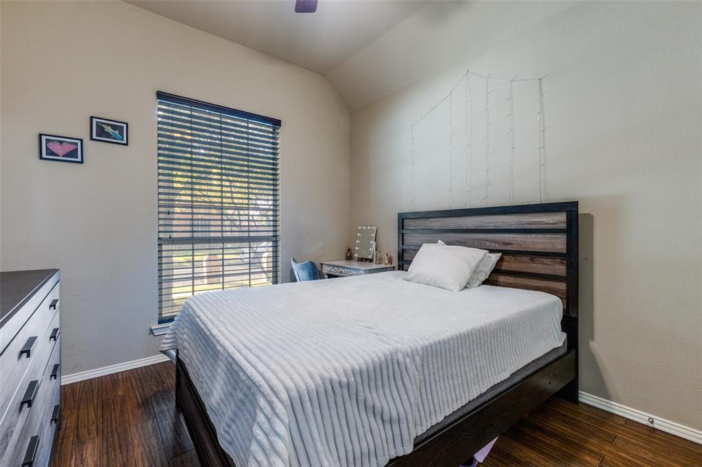 1046 Gold Camp Road Frisco, TX 75033 - Photo 16 of 25 a bed sitting in a bedroom next to a window