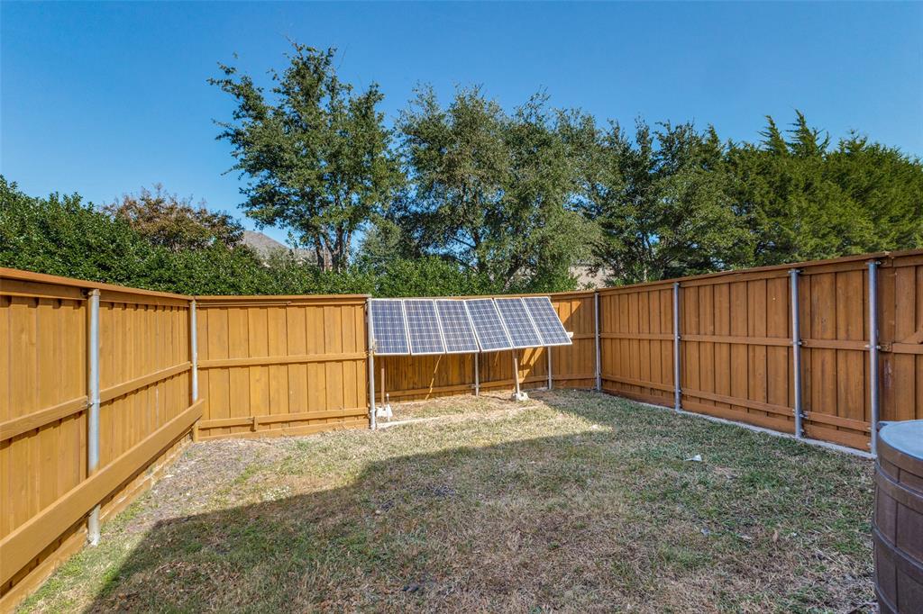 1046 Gold Camp Road Frisco, TX 75033 - Photo 21 of 25 a view of backyard with wooden fence
