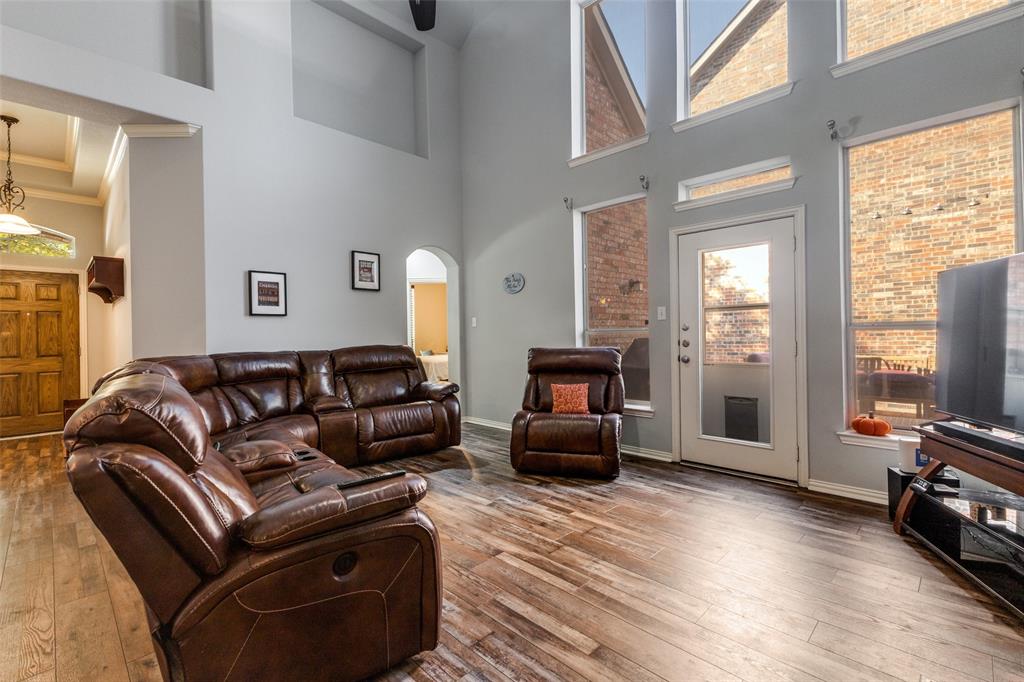 1046 Gold Camp Road Frisco, TX 75033 - Photo 4 of 25 a living room with furniture window and a flat screen tv