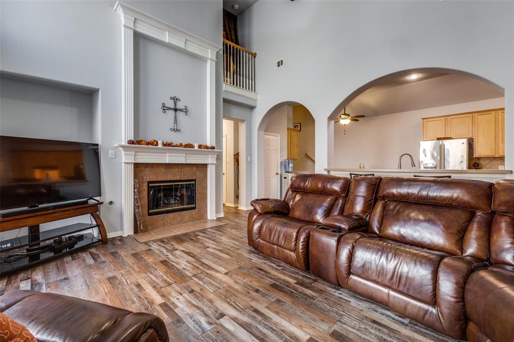 1046 Gold Camp Road Frisco, TX 75033 - Photo 5 of 25 a living room with furniture and a flat screen tv