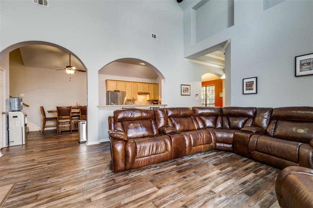 1046 Gold Camp Road Frisco, TX 75033 - Photo 6 of 25 a living room with furniture and a wooden floor