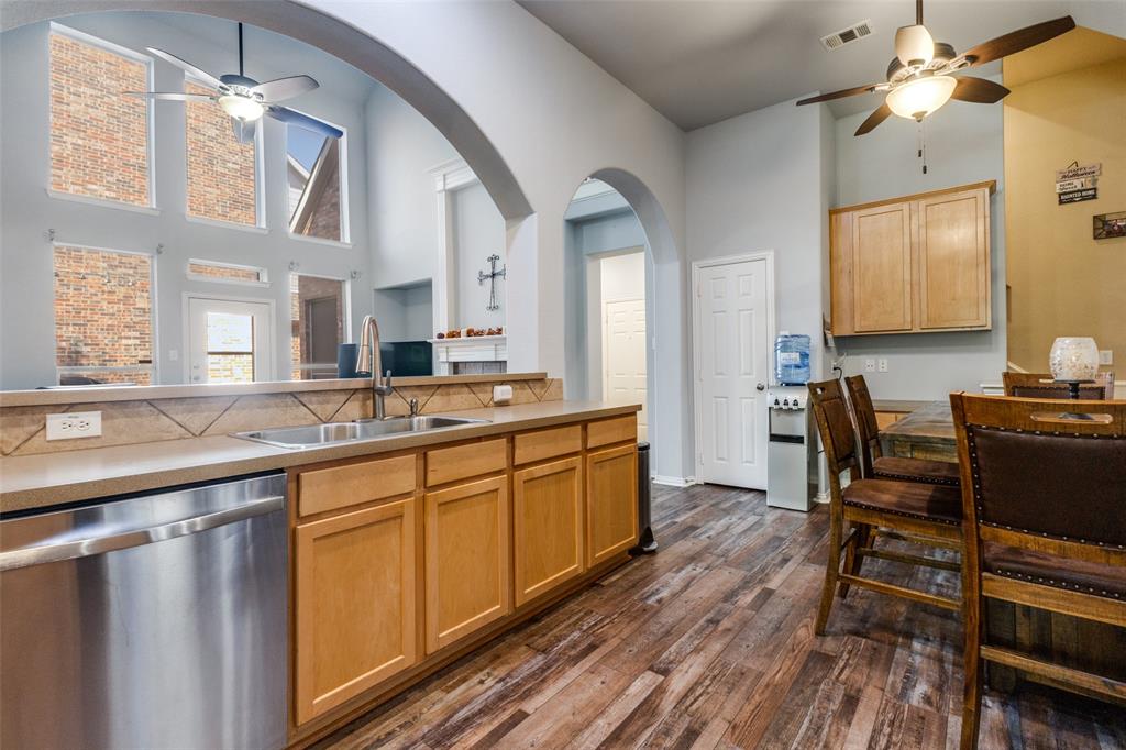 1046 Gold Camp Road Frisco, TX 75033 - Photo 8 of 25 a large kitchen with a table and chairs in it