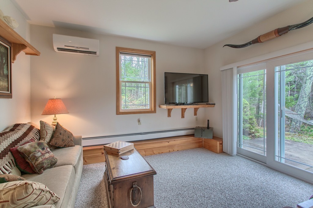 232 Worcester Road Westminster, MA 01473 - Photo 24 of 30 a living room with furniture and a flat screen tv