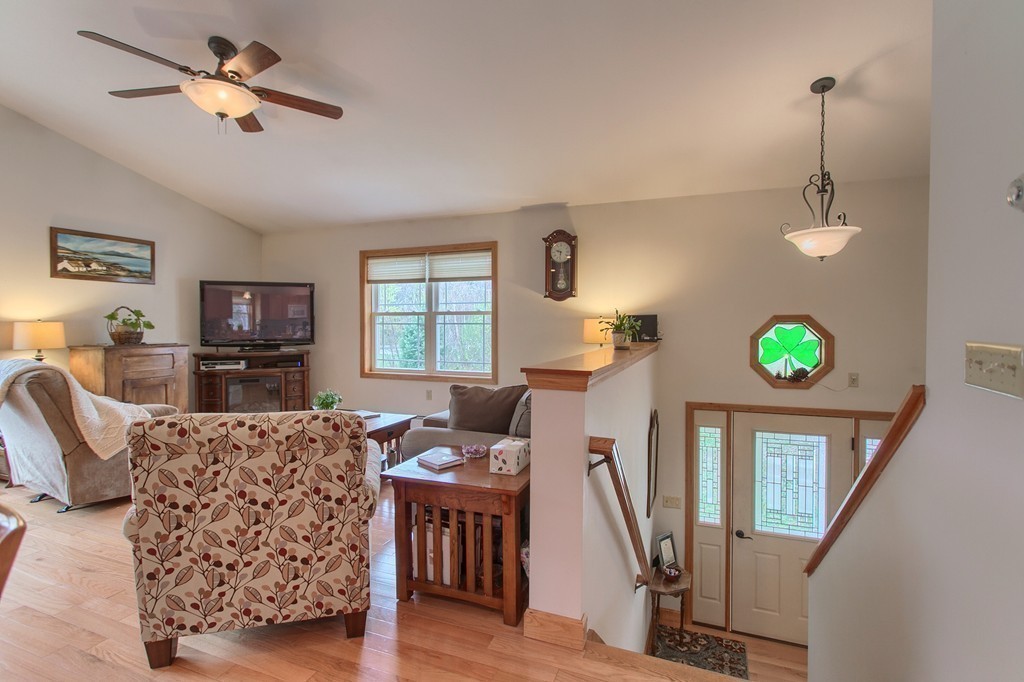 232 Worcester Road Westminster, MA 01473 - Photo 6 of 30 a view of a livingroom with furniture hardwood floor and a flat screen tv