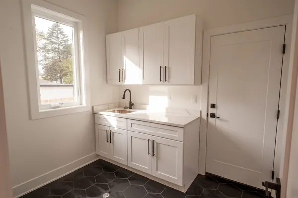 a bathroom with a sink and a window