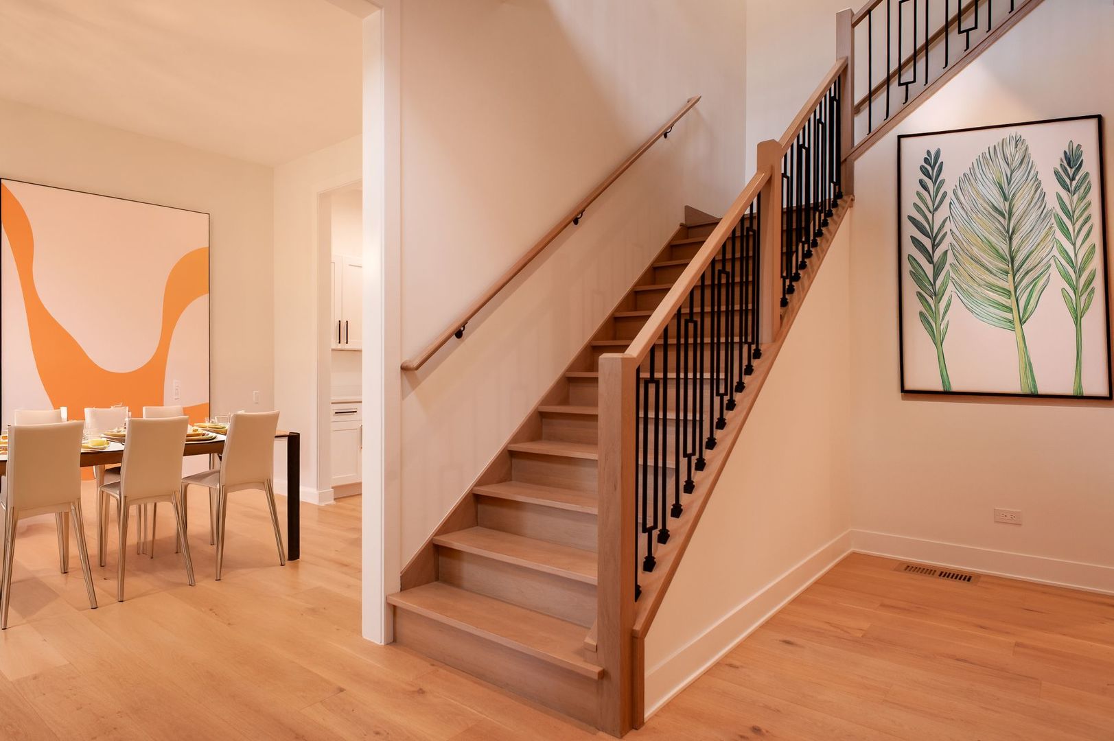 515 East Wilson Avenue Lombard, IL 60148 - Photo 4 of 25 a view of staircase with lots of frames on wall and a painting