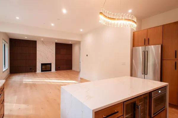 a kitchen with a refrigerator and a refrigerator