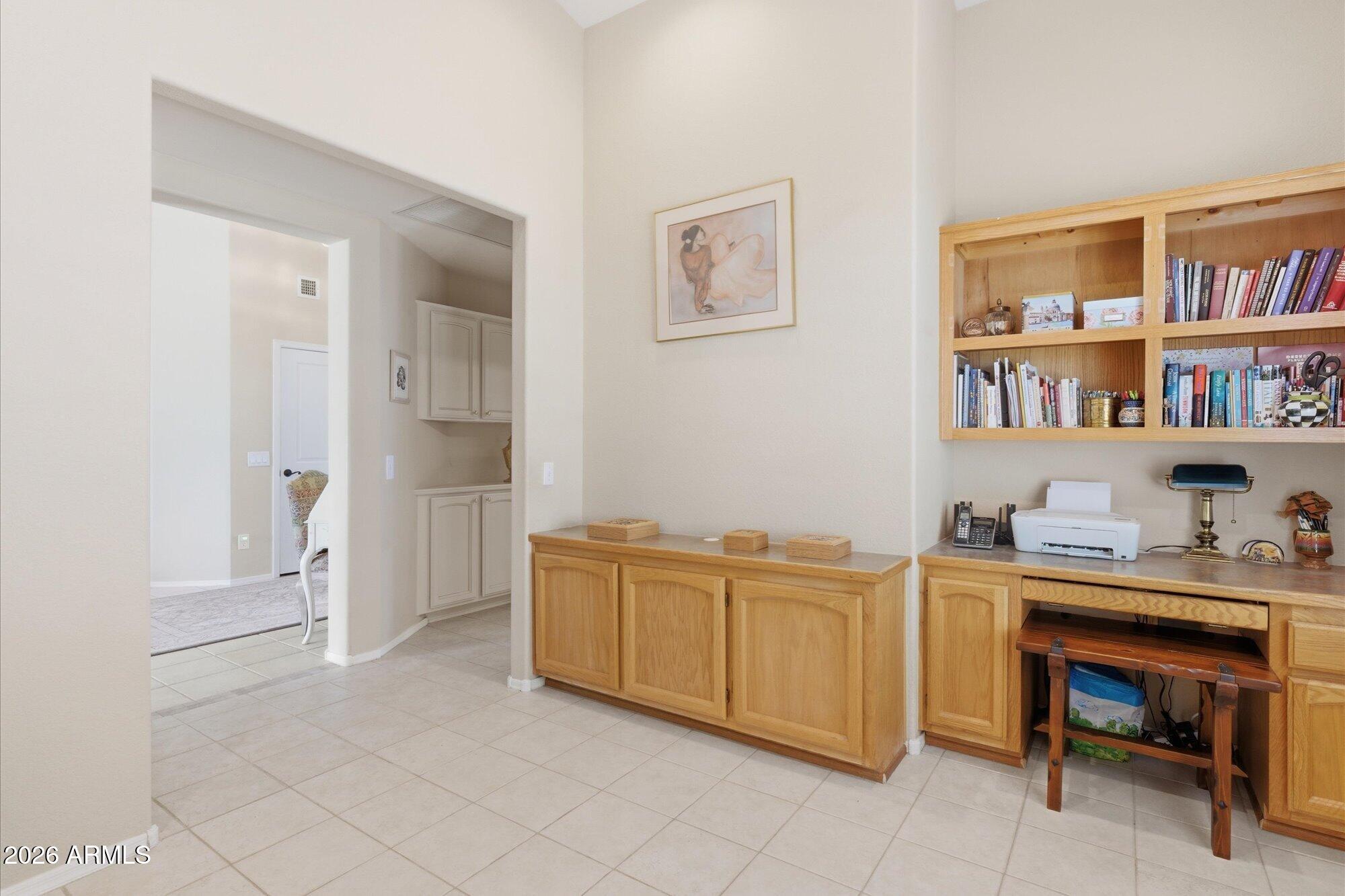 3895 North 150th Lane Goodyear, AZ 85395 - Photo 12 of 34 a view of a workspace with furniture