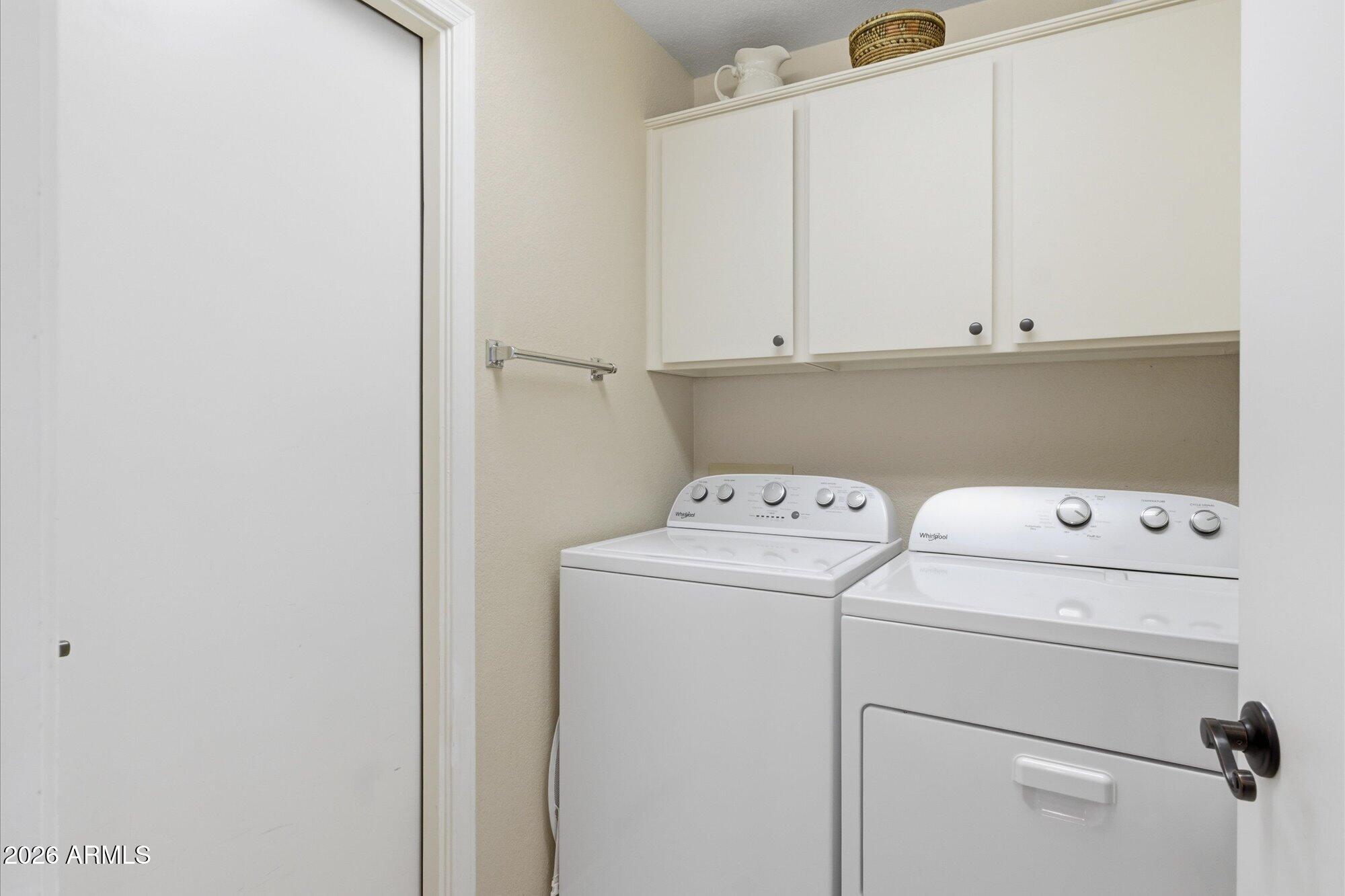 3895 North 150th Lane Goodyear, AZ 85395 - Photo 20 of 34 a utility room with dryer and washer