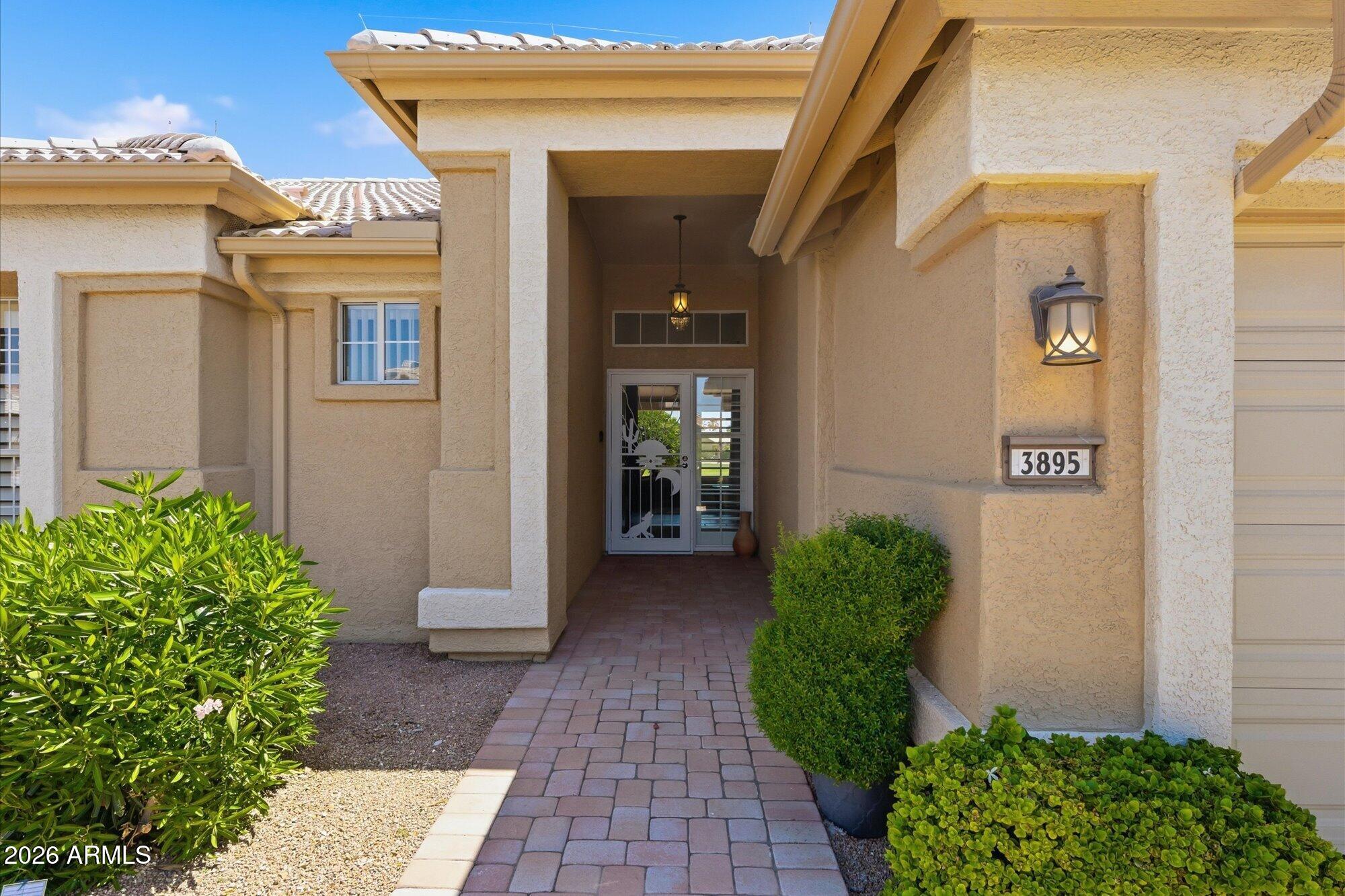 3895 North 150th Lane Goodyear, AZ 85395 - Photo 2 of 34 a view of a pathway of a house