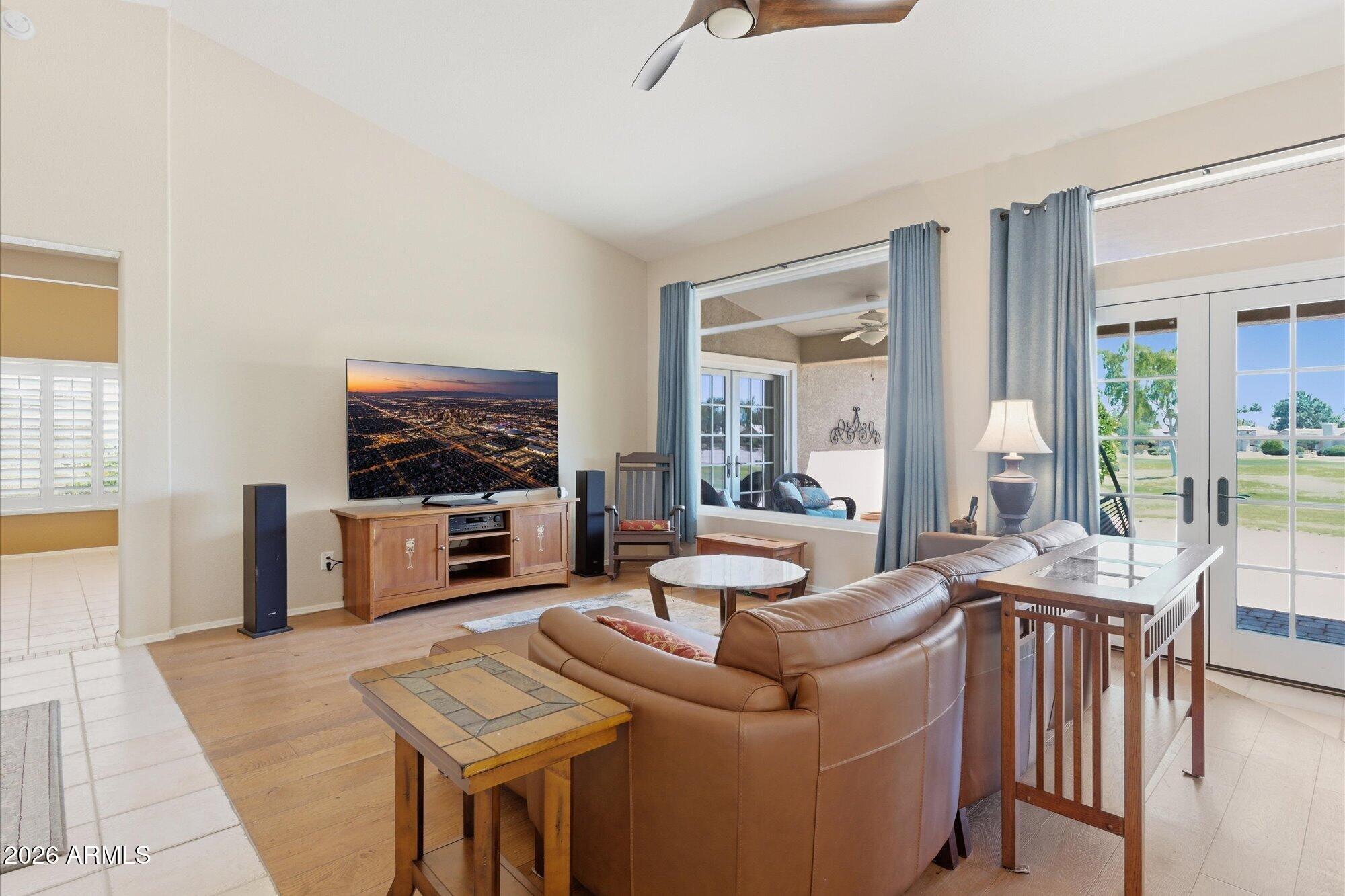 3895 North 150th Lane Goodyear, AZ 85395 - Photo 6 of 34 a living room with furniture and a flat screen tv