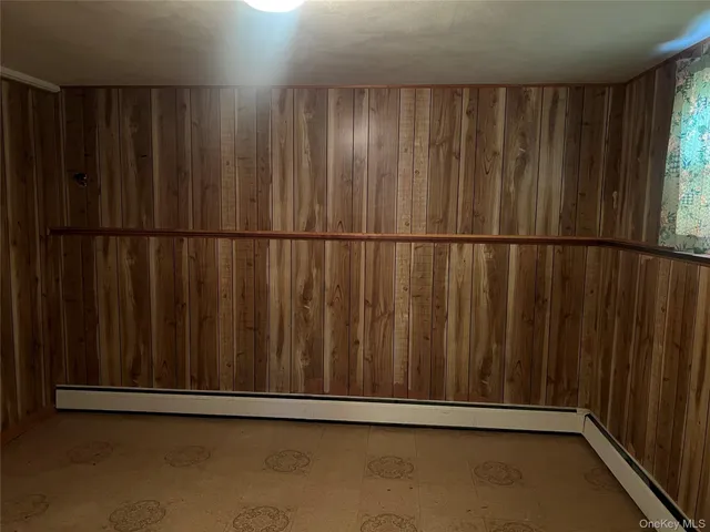 a view of a hallway with windows