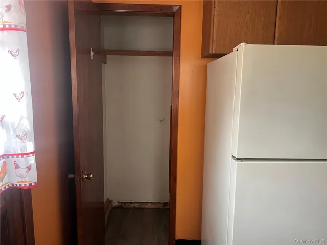 a white refrigerator freezer sitting inside of a kitchen