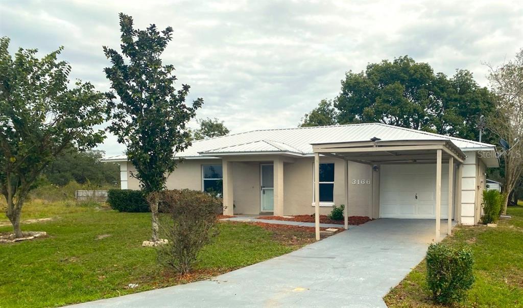 3166 North Sedgewick Road Avon Park, FL 33825 - Photo 1 of 1 a view of a house with backyard