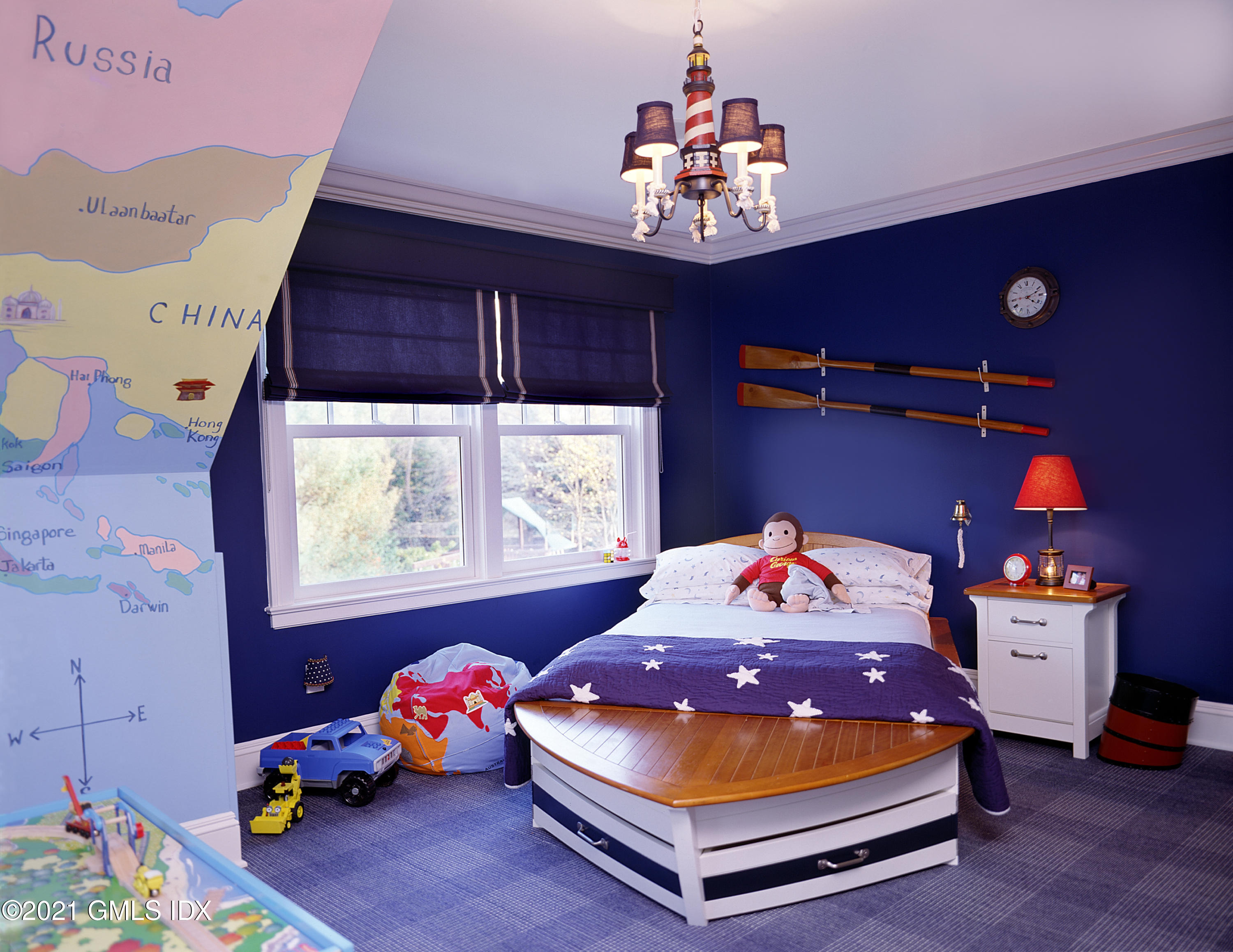 200 Byram Shore Road Greenwich, CT 06830 - Photo 20 of 27 a blue bed sitting in a bedroom next to a window