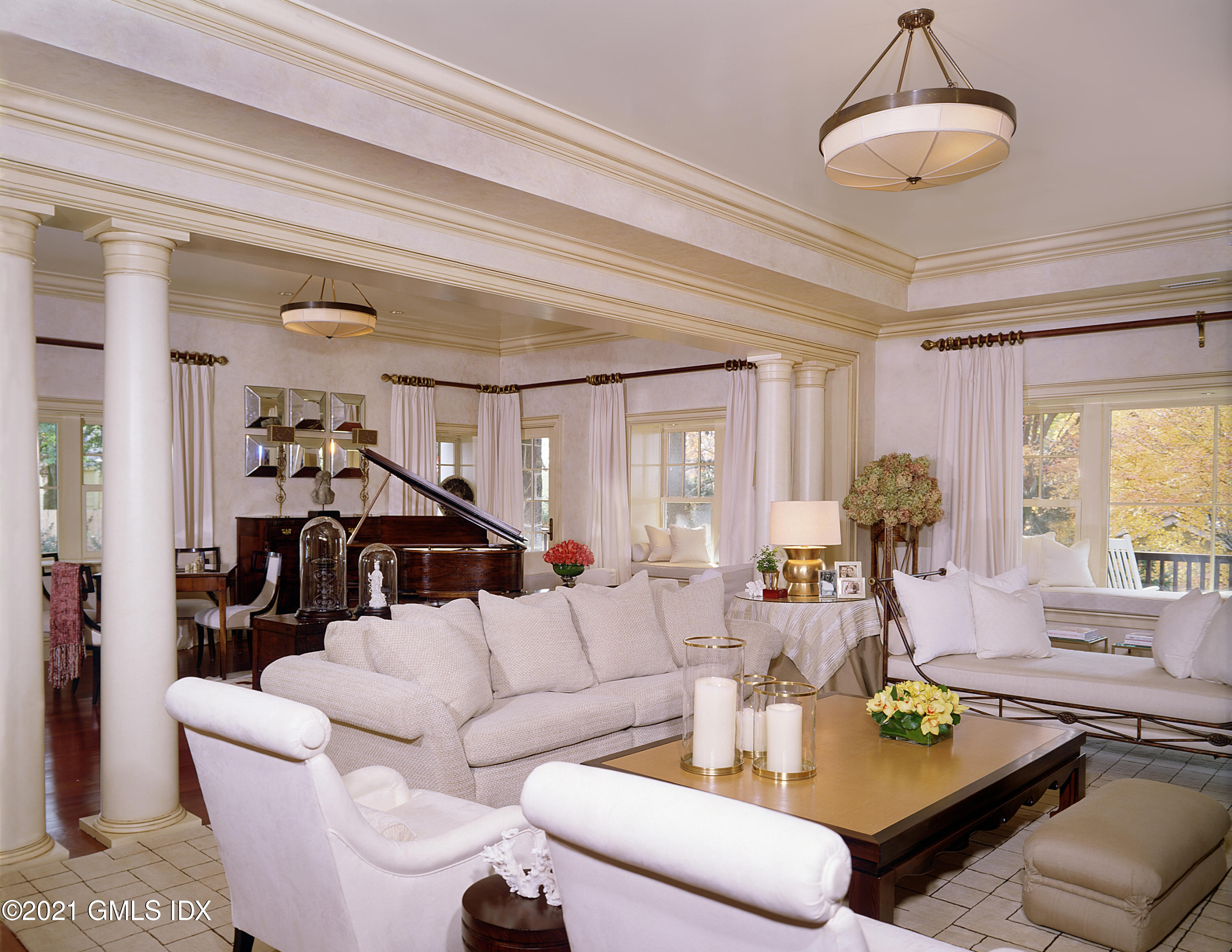 200 Byram Shore Road Greenwich, CT 06830 - Photo 4 of 27 a living room with furniture and a chandelier