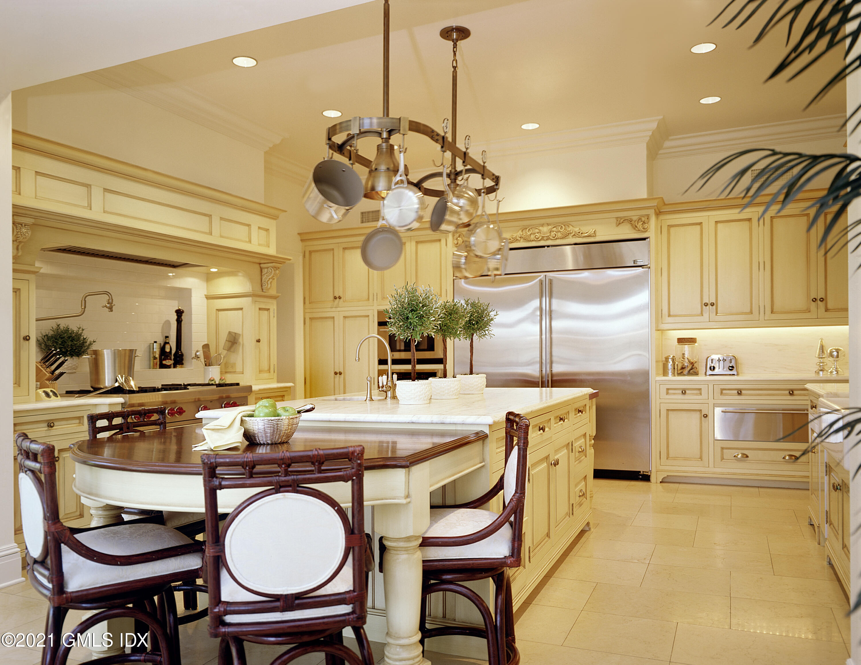 200 Byram Shore Road Greenwich, CT 06830 - Photo 6 of 27 a dining room filled chandelier and wooden furniture