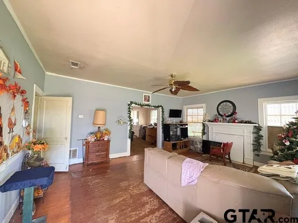 a living room with furniture and a fireplace