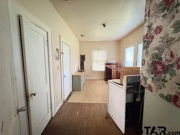 a kitchen with stainless steel appliances a refrigerator and a stove