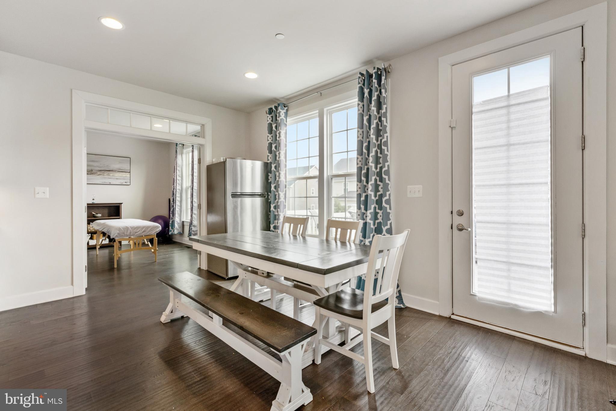 4300 Open Field Court Bowie, MD 20720 - Photo 11 of 53 a living room with furniture a wooden floor and a window