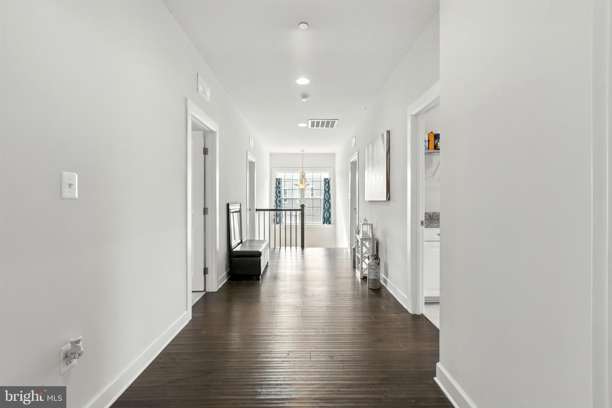 4300 Open Field Court Bowie, MD 20720 - Photo 17 of 53 a view of a hallway with wooden floor