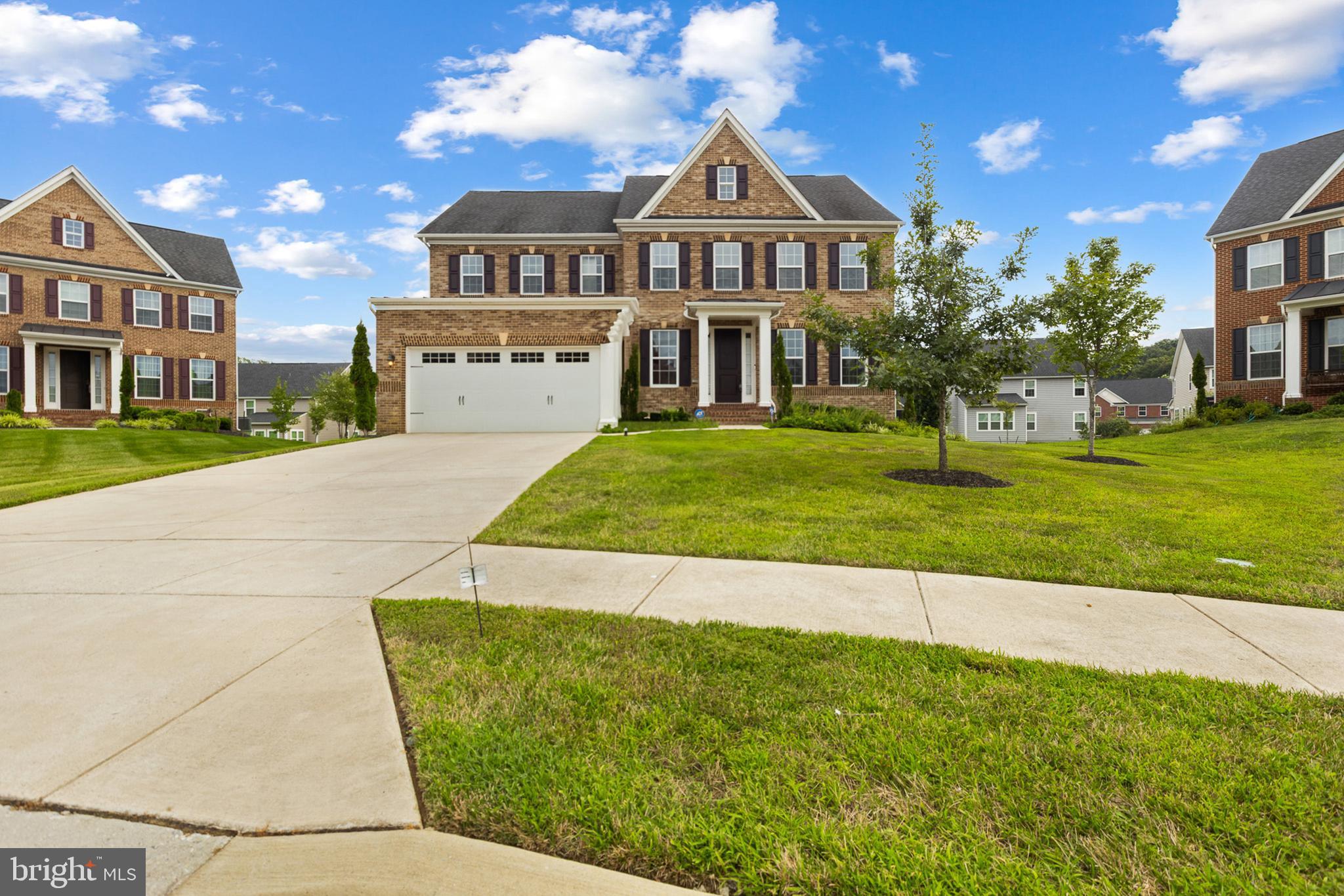 4300 Open Field Court Bowie, MD 20720 - Photo 2 of 53 a front view of a house with a yard