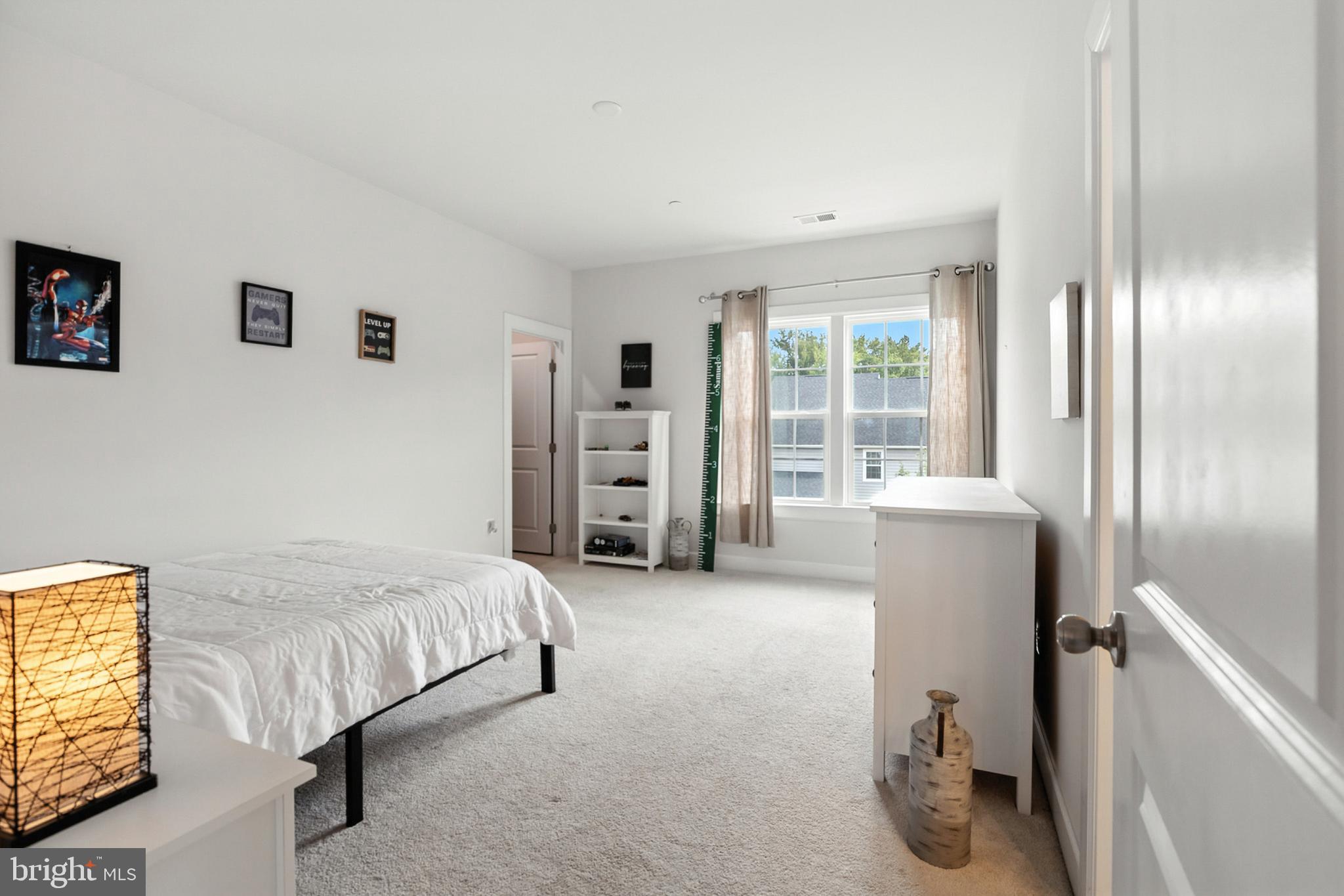 4300 Open Field Court Bowie, MD 20720 - Photo 26 of 53 a bedroom with a bed and a large window