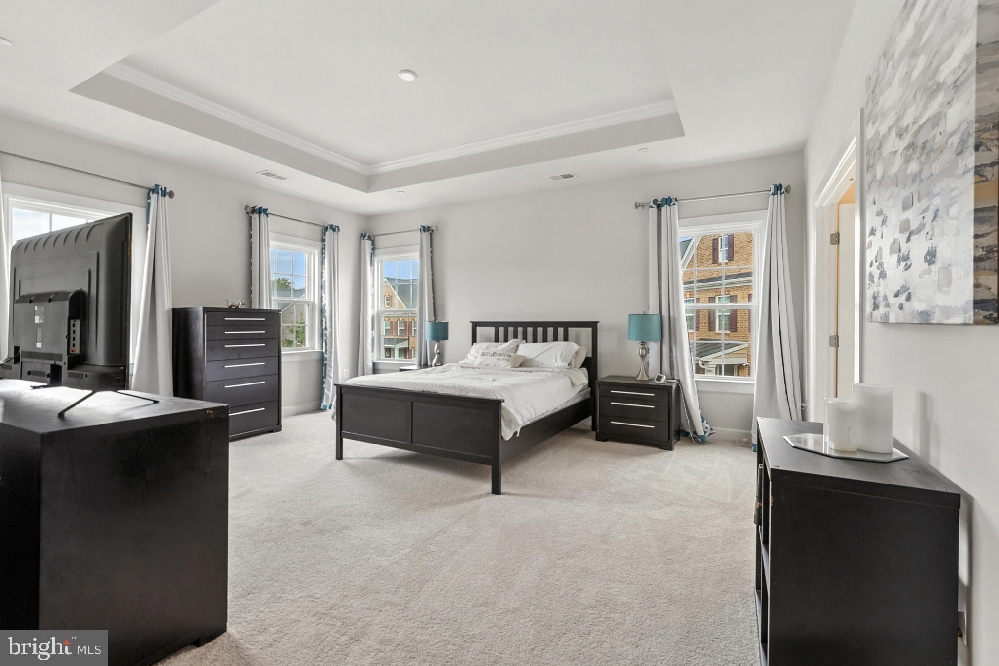 4300 Open Field Court Bowie, MD 20720 - Photo 29 of 53 a spacious bedroom with a bed and a couch