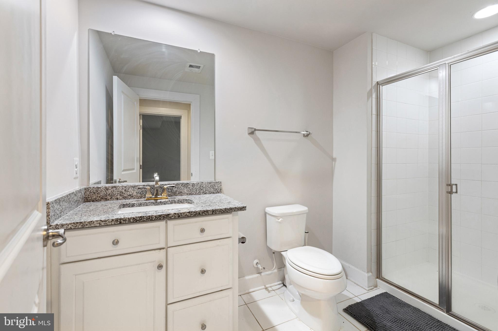 4300 Open Field Court Bowie, MD 20720 - Photo 41 of 53 a bathroom with a granite countertop toilet sink and mirror