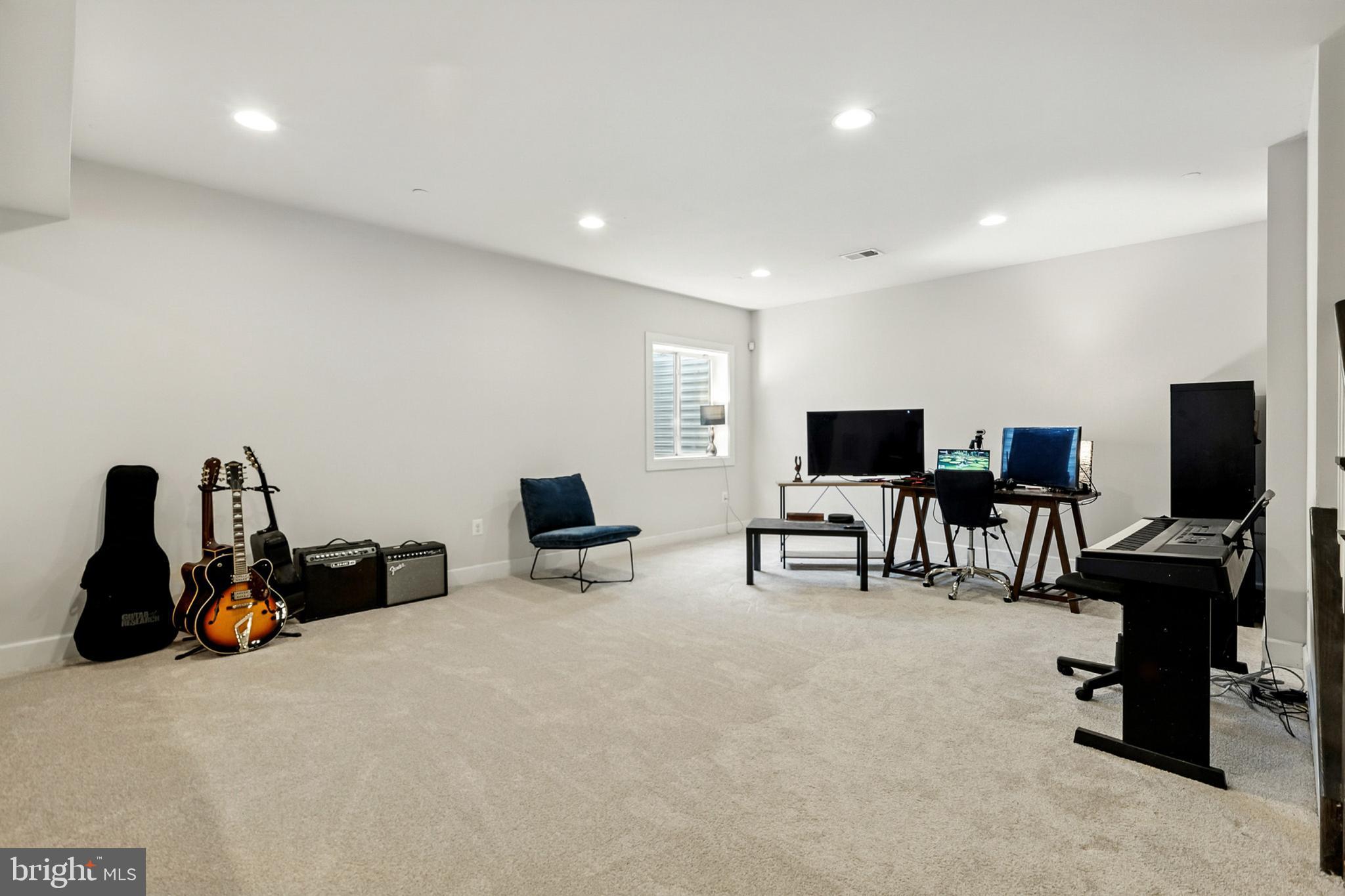 4300 Open Field Court Bowie, MD 20720 - Photo 42 of 53 a room with furniture and flat screen tv