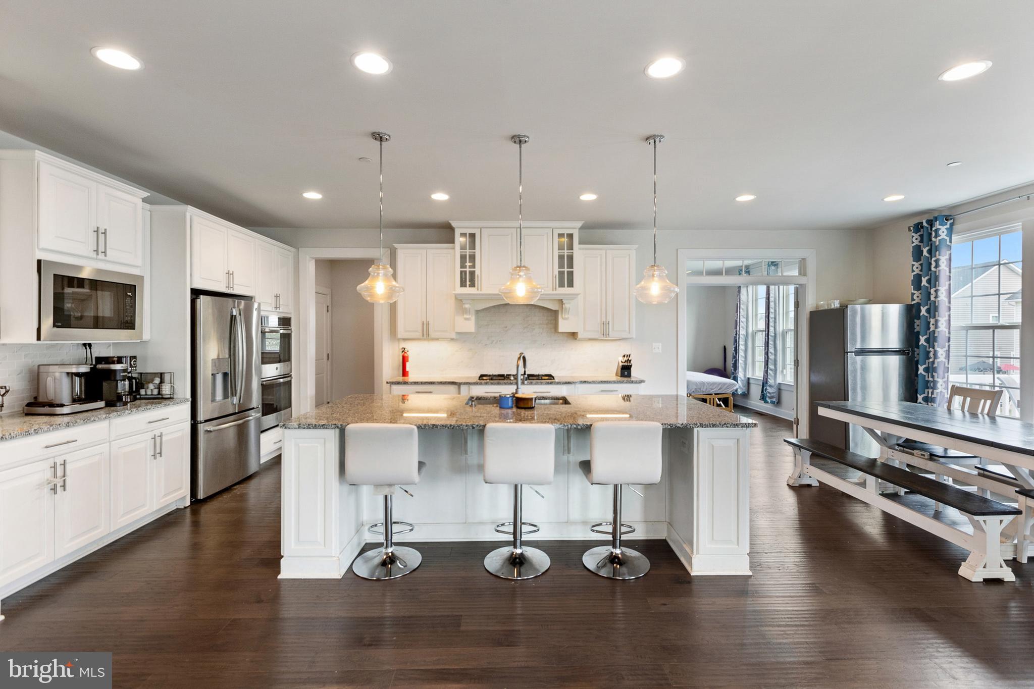 4300 Open Field Court Bowie, MD 20720 - Photo 7 of 53 a kitchen with a sink stainless steel appliances and cabinets