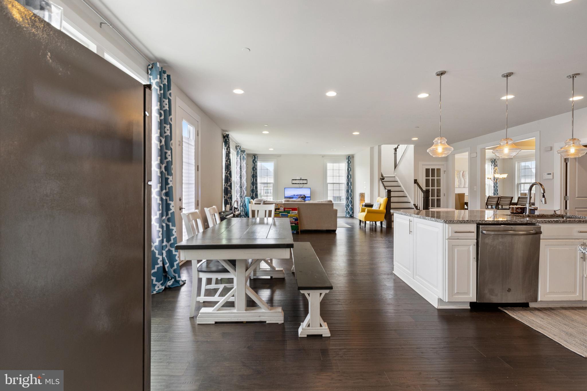 4300 Open Field Court Bowie, MD 20720 - Photo 10 of 53 a view of a kitchen with kitchen island stainless steel appliances refrigerator stove microwave and cabinets