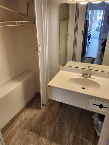 a bathroom with a toilet and a bathtub