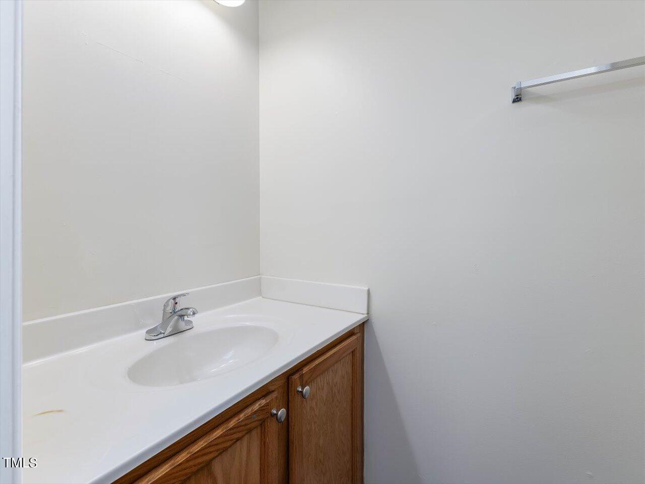 2907 Dearborn Drive Durham, NC 27704 - Photo 12 of 52 a bathroom with a sink and a mirror