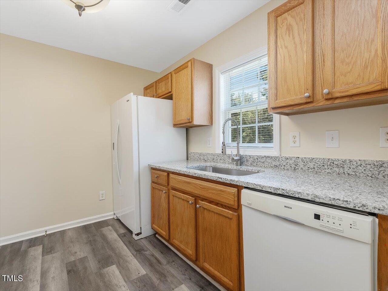 2907 Dearborn Drive Durham, NC 27704 - Photo 18 of 52 a kitchen with a sink cabinets and a window